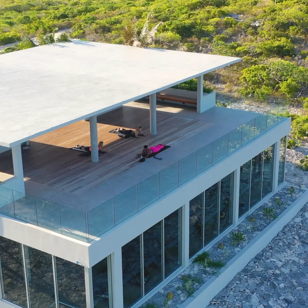 Aerial view of an open-air pavilion surrounded by greenery