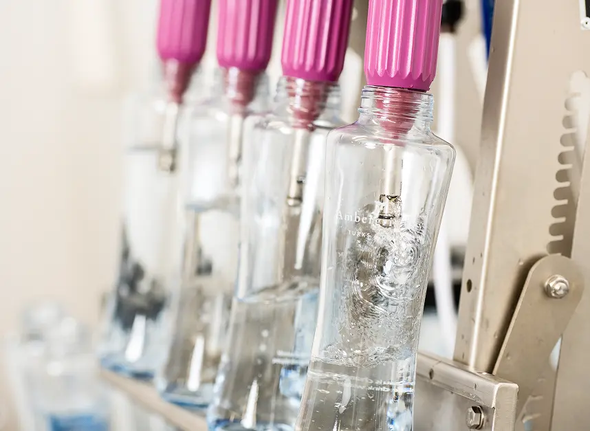 Glass bottles being filled at the island's water bottling plant